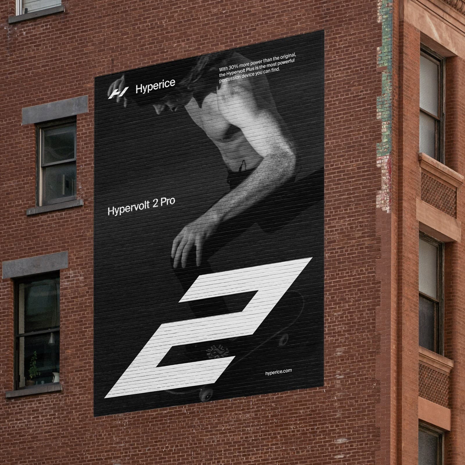 Hypervolt 2 Pro billboard on a brick building